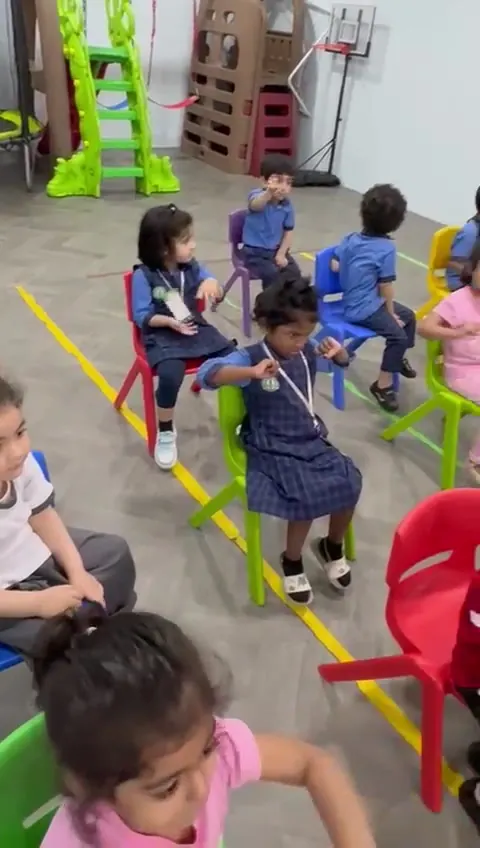 Children sitting together during circle time at King Fahd Centre