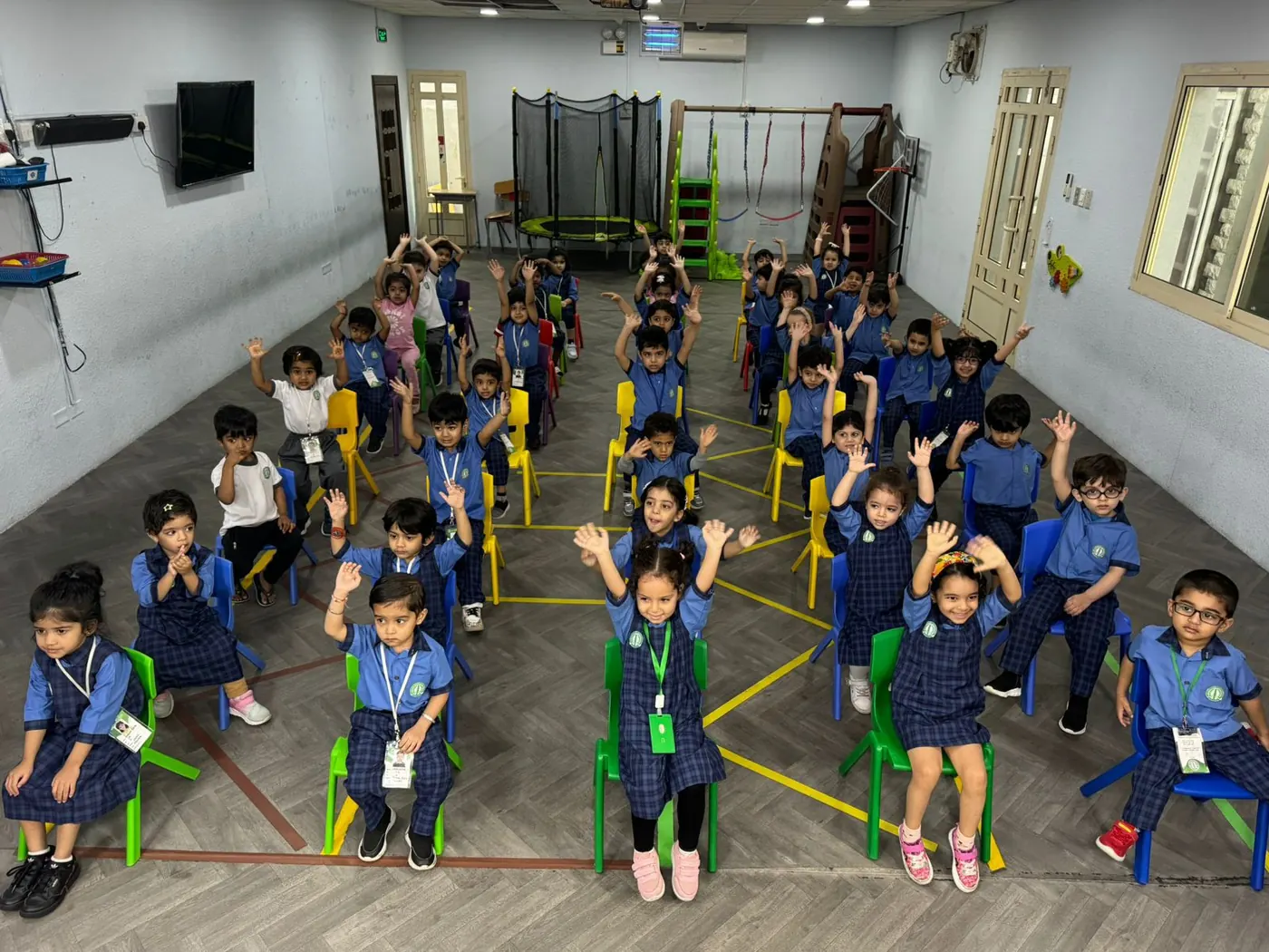 Children seated together at King Fahd Centre
