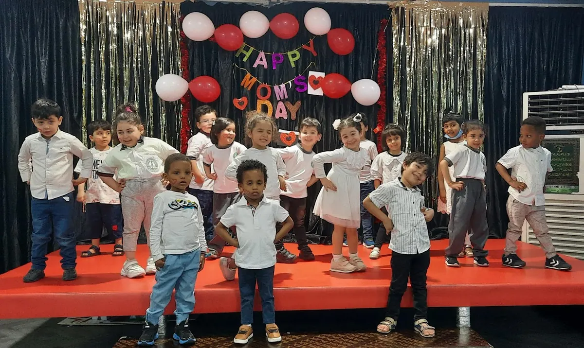 Children performing on stage at a centre celebration